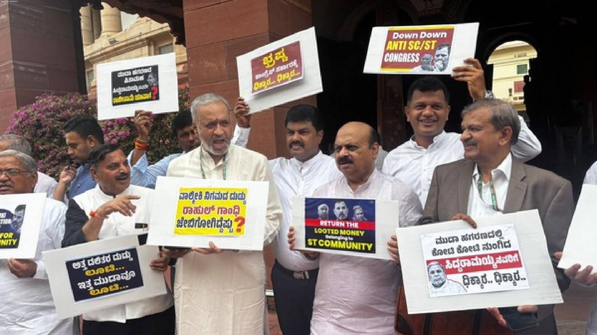 Karnataka BJP members protest over MUDA and Valmiki scam in Parliament premises